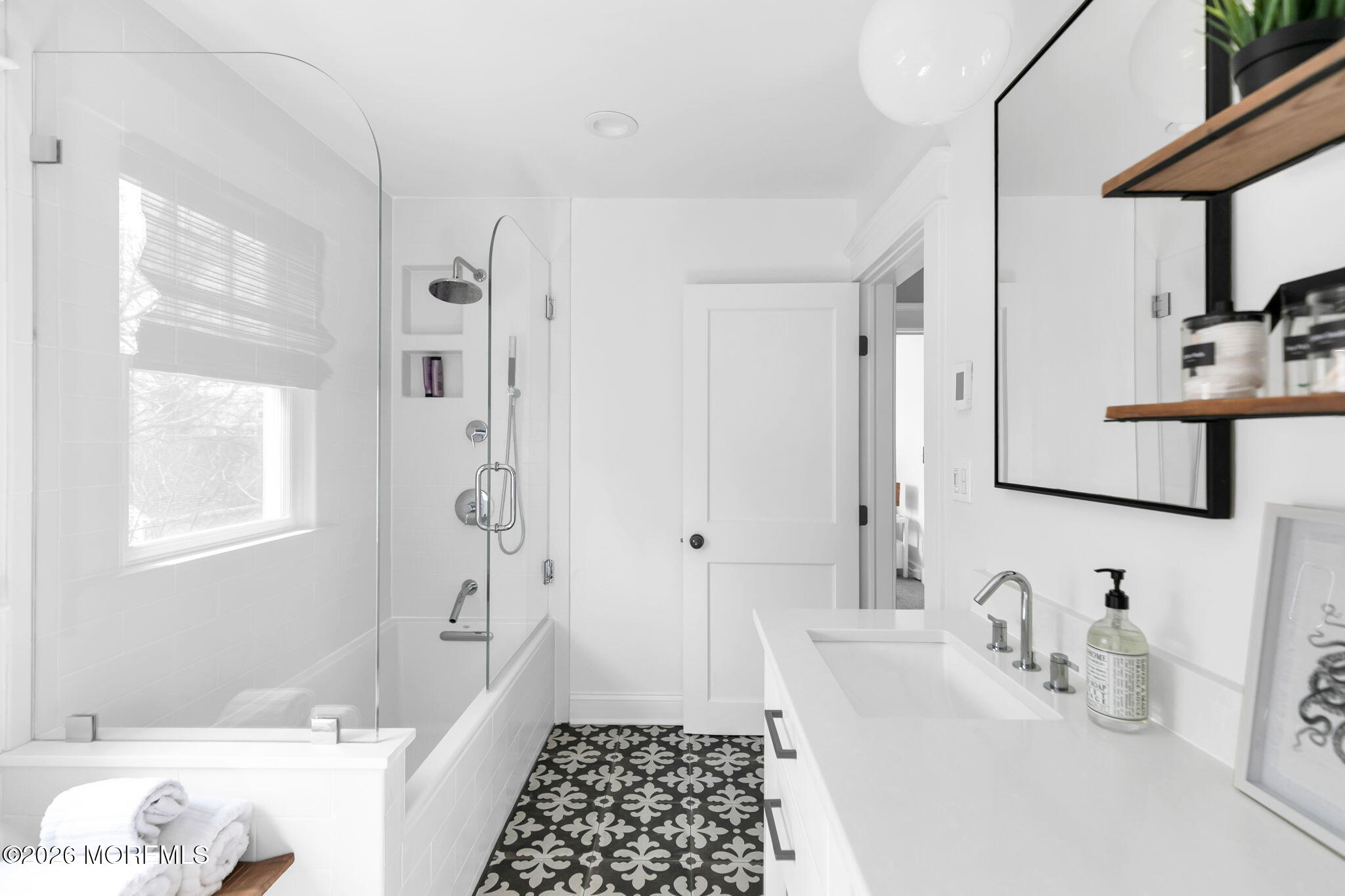 43 Bingham Avenue Rumson, NJ 07760 - Photo 49 of 59 a bathroom with a tub sink and a window