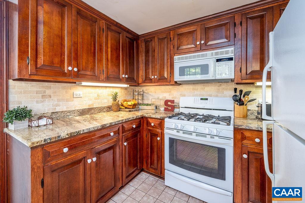 19 Old Farm Road Charlottesville, VA 22903 - Photo 11 of 29 a kitchen with stainless steel appliances granite countertop a stove and a sink