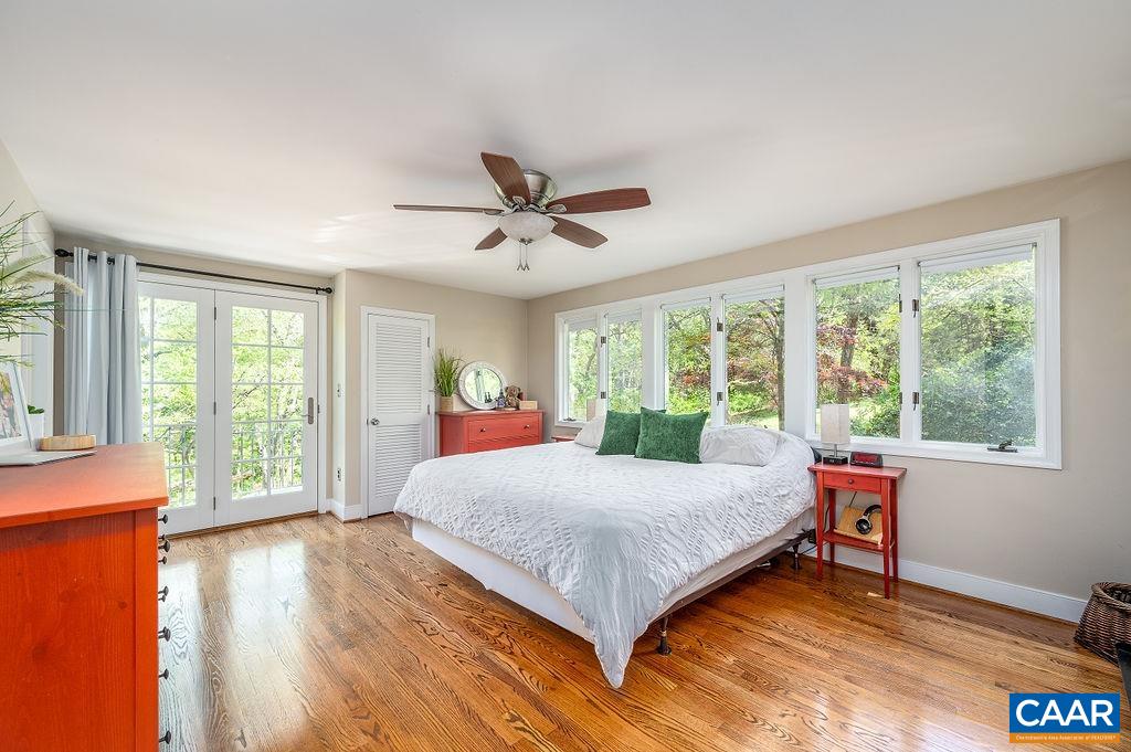 19 Old Farm Road Charlottesville, VA 22903 - Photo 15 of 29 a bedroom with a large bed and a large window