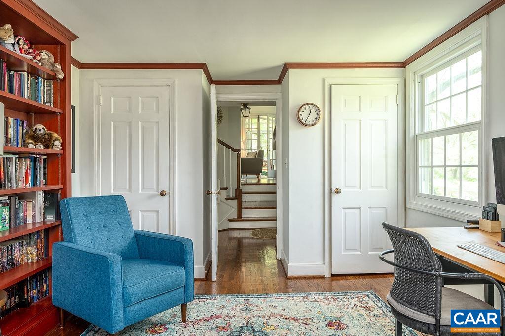 19 Old Farm Road Charlottesville, VA 22903 - Photo 8 of 29 a living room with furniture and a book shelf