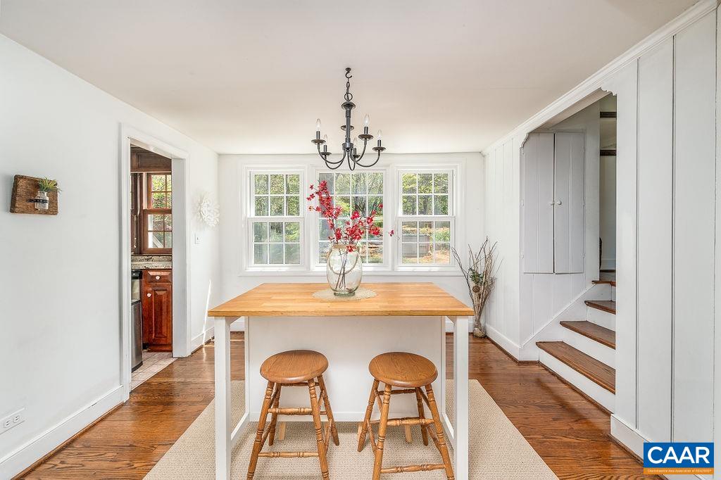 19 Old Farm Road Charlottesville, VA 22903 - Photo 10 of 29 a view of a dining room with furniture window and wooden floor