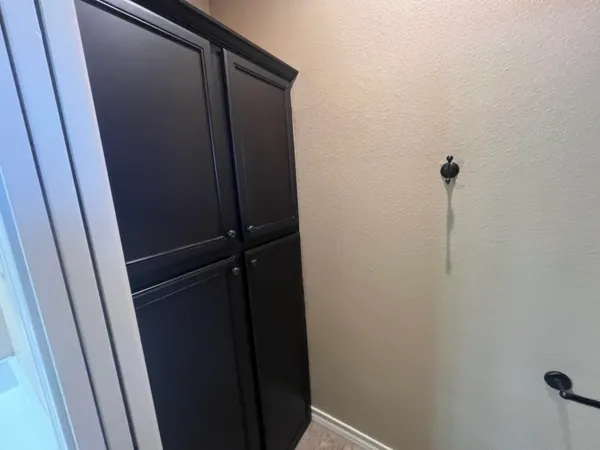 a bathroom with a shower and a mirror