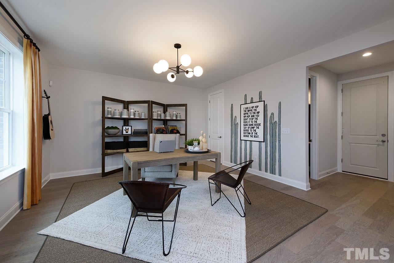 3251 Lynn Road, Unit 17 Raleigh, NC 27613 - Photo 6 of 22 a view of a livingroom with furniture and window