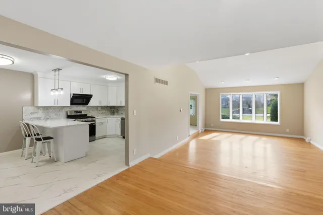 a kitchen with a stove a sink and a refrigerator