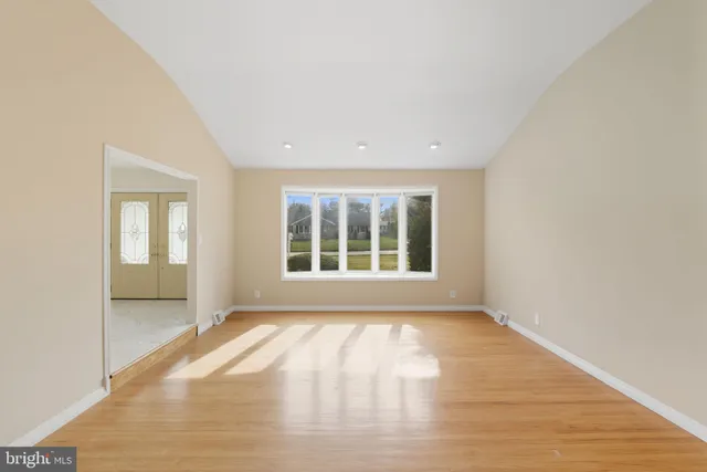 a kitchen with kitchen island a counter space a sink appliances and cabinets