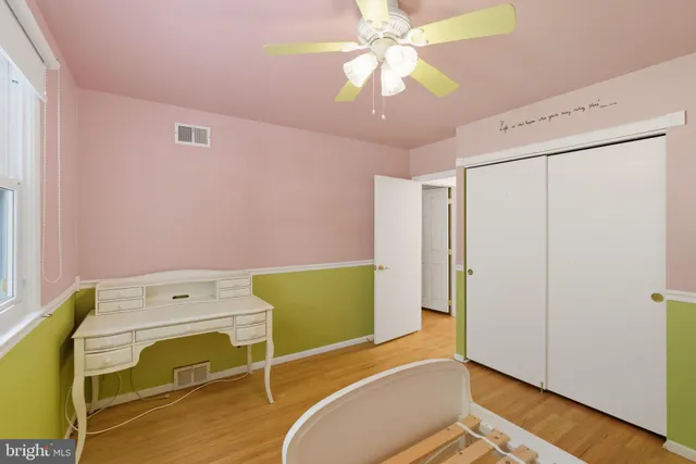 a bathroom with a sink vanity and mirror