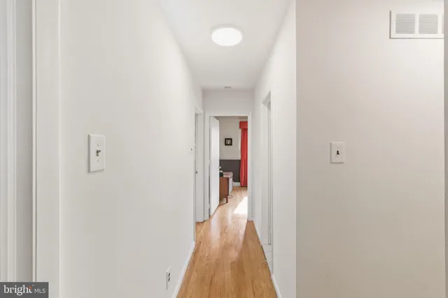 a kitchen with stainless steel appliances kitchen island granite countertop dining table chairs and a rug