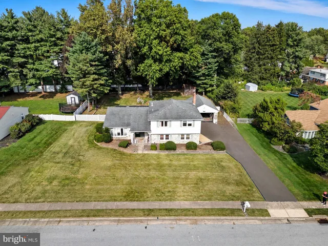 a view of a swimming pool with some potted plants