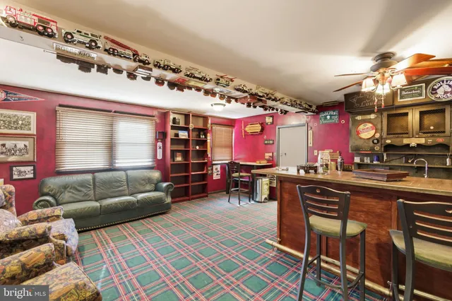 a view of a patio with table and chairs and potted plants