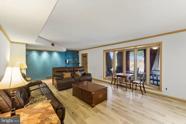 a swimming pool with outdoor seating and yard