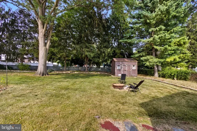 a white toilet sitting next to a bathroom sink and tub