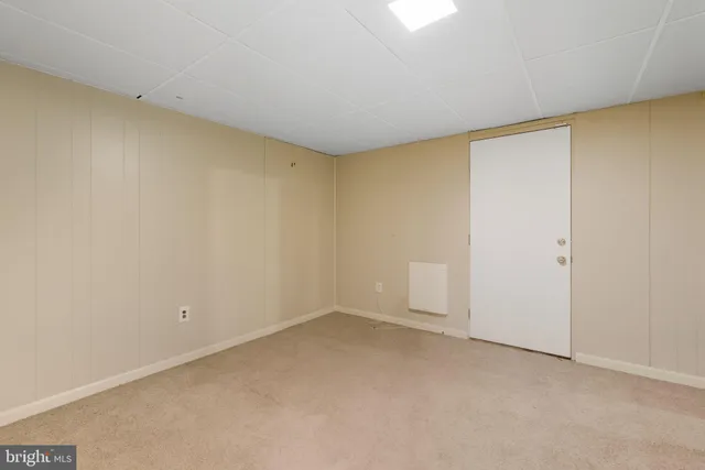 an aerial view of a house with a yard basket ball court and outdoor seating