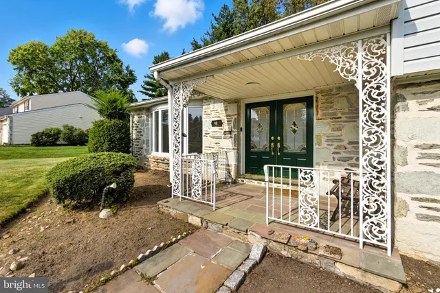 a view of a patio with table and chairs and potted plants