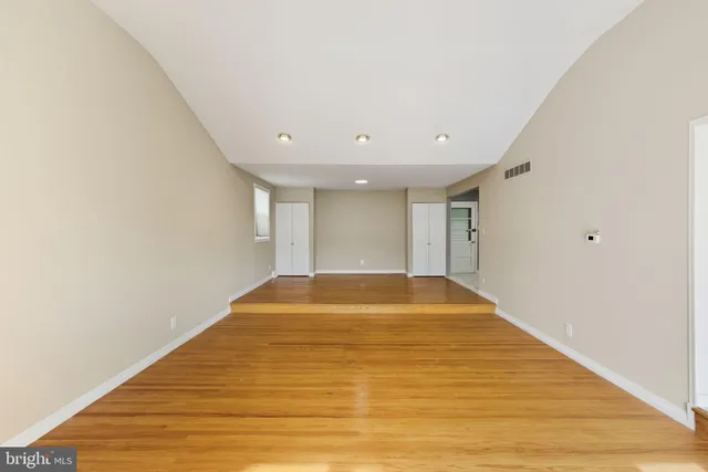 a view of kitchen with sink microwave and refrigerator