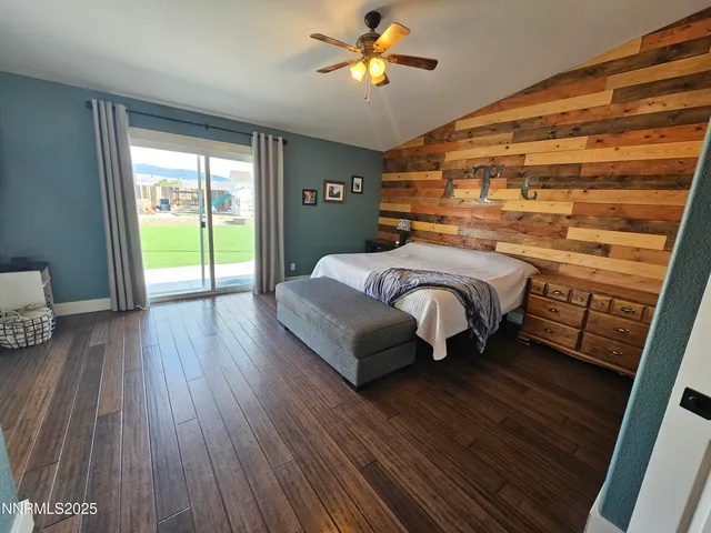 a bathroom with a toilet and a mirror