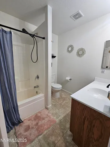 a view of a backyard with sitting area