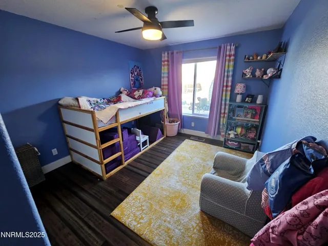 a view of swimming pool with a yard in front of it