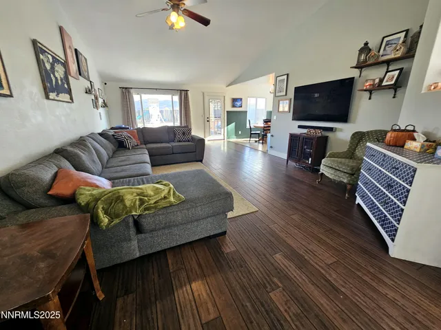 a kitchen with granite countertop lots of counter top space a sink a stove and a window