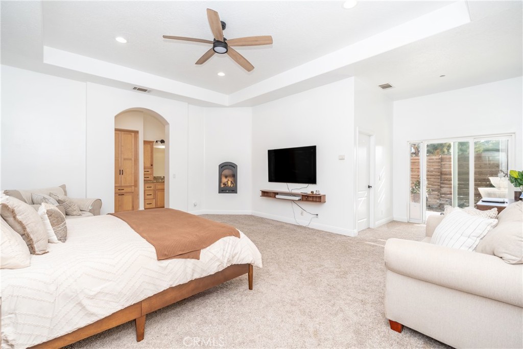 1830 Calaveras Road Pinon Hills, CA 92372 - Photo 11 of 38 a bedroom with a bed and a flat screen tv