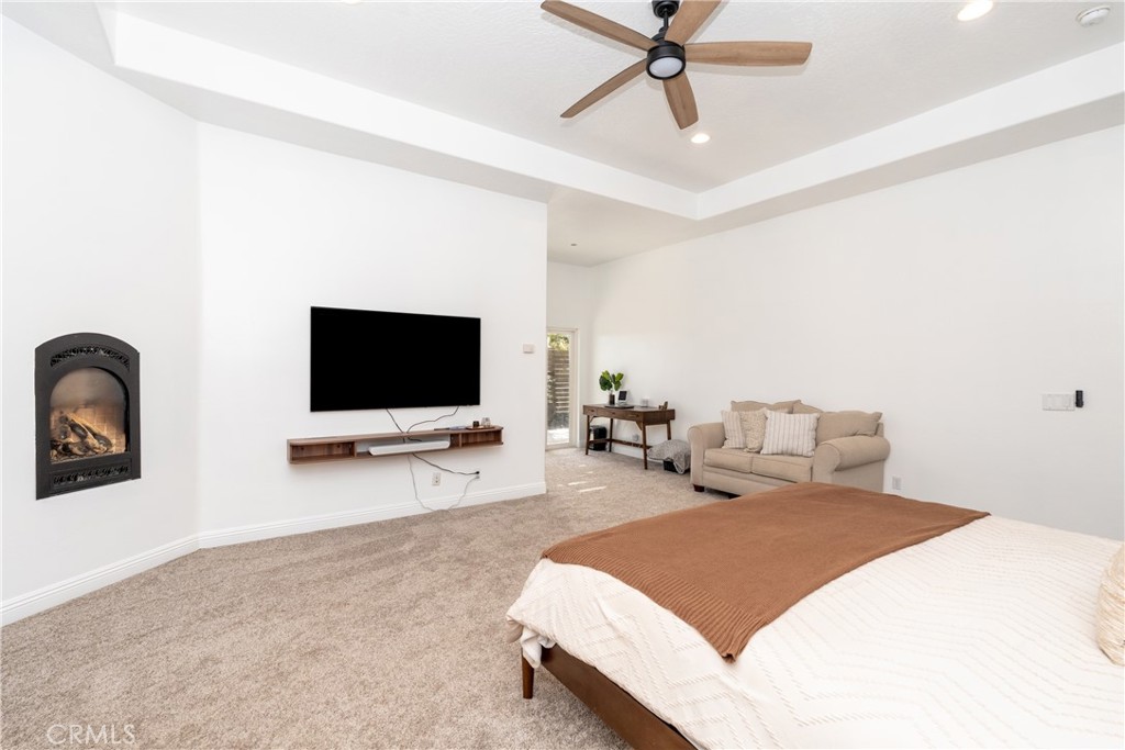 1830 Calaveras Road Pinon Hills, CA 92372 - Photo 12 of 38 a bedroom with a bed and a flat screen tv