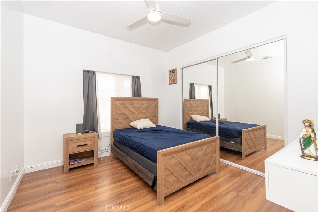 1830 Calaveras Road Pinon Hills, CA 92372 - Photo 15 of 38 a bedroom with a bed and a chandelier