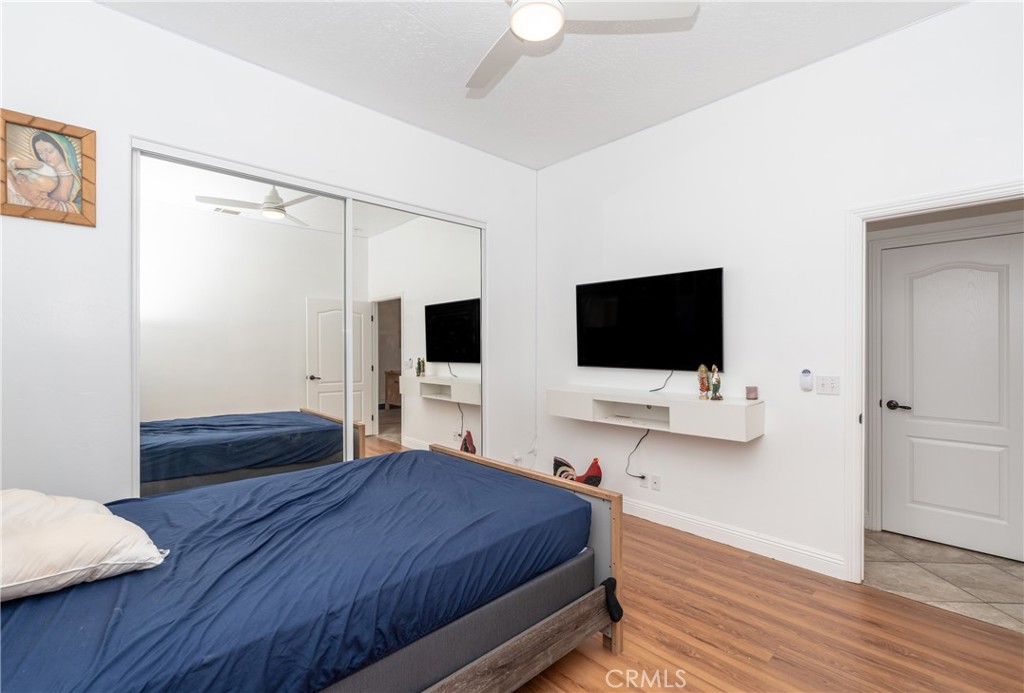 1830 Calaveras Road Pinon Hills, CA 92372 - Photo 16 of 38 a bedroom with a bed and a flat screen tv