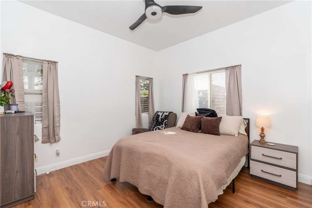 1830 Calaveras Road Pinon Hills, CA 92372 - Photo 17 of 38 a bedroom with a bed and wooden floor