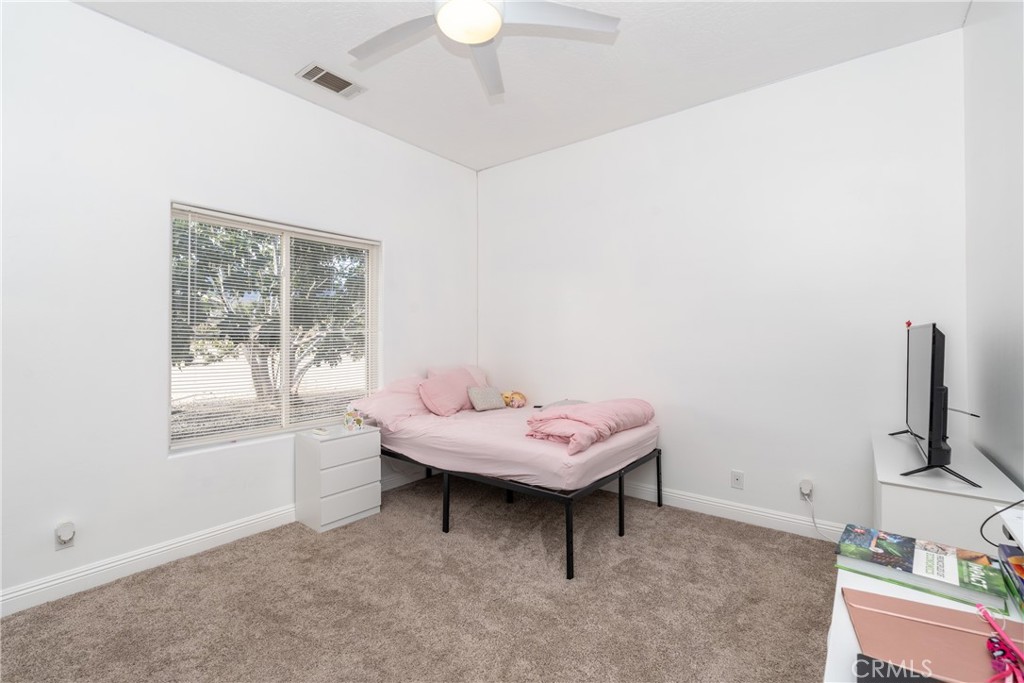 1830 Calaveras Road Pinon Hills, CA 92372 - Photo 22 of 38 a living room with furniture and a window
