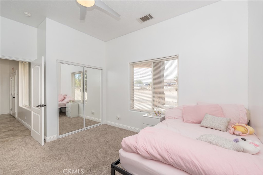 1830 Calaveras Road Pinon Hills, CA 92372 - Photo 23 of 38 a bedroom with a bed and a window