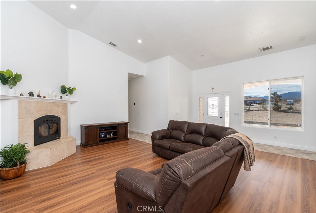 1830 Calaveras Road Pinon Hills, CA 92372 - Photo 6 of 38 a living room with furniture window and a fireplace