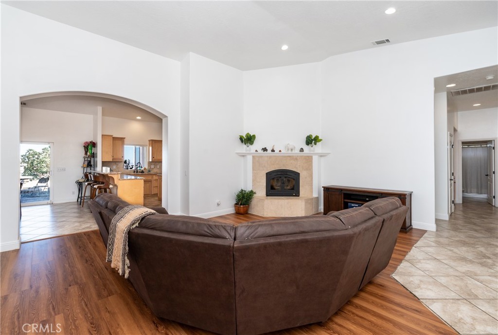 1830 Calaveras Road Pinon Hills, CA 92372 - Photo 7 of 38 a living room with furniture and a fireplace