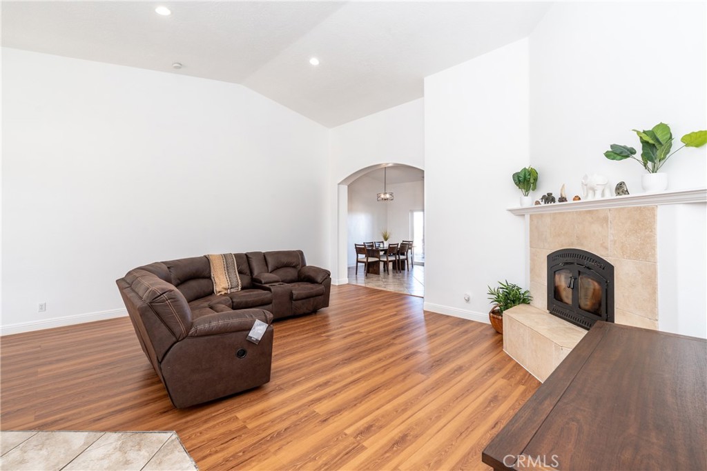 1830 Calaveras Road Pinon Hills, CA 92372 - Photo 8 of 38 a living room with furniture and a fireplace