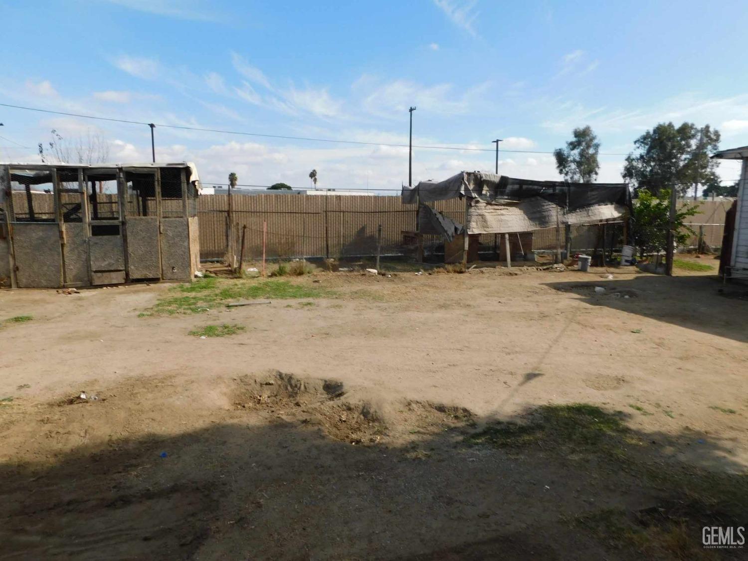 Undisclosed Address Bakersfield, CA 93305 - Photo 17 of 22 a view of a dirt road and a building