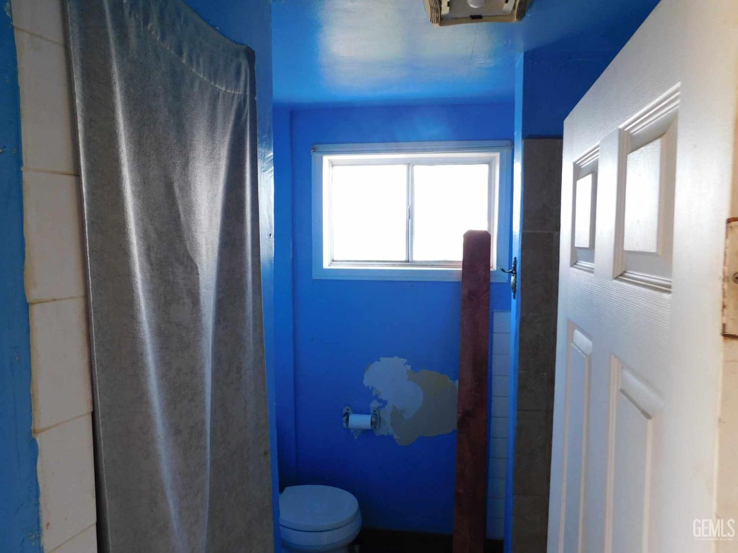 Undisclosed Address Bakersfield, CA 93305 - Photo 21 of 22 a bathroom with a toilet