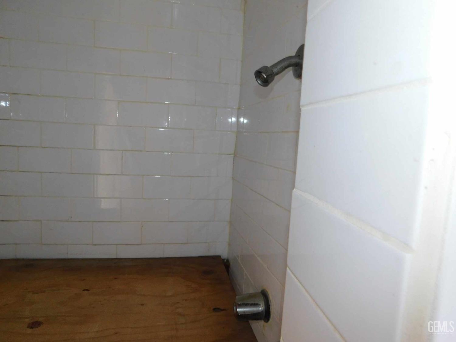 Undisclosed Address Bakersfield, CA 93305 - Photo 9 of 22 a bathroom with a shower