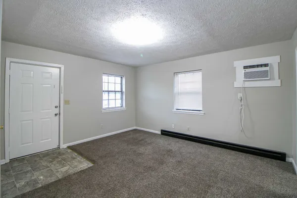 a view of an empty room with windows