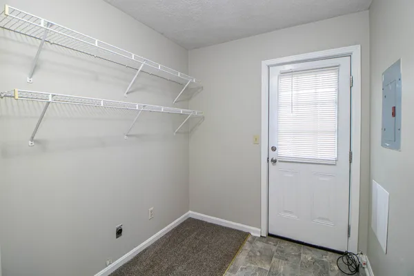 a view of a room with racks on the wall