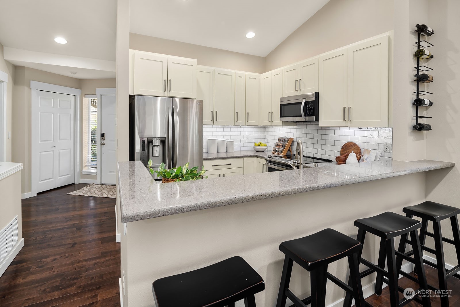 18651 Northeast 55th Way, Unit PP Redmond, WA 98052 - Photo 11 of 35 a kitchen with stainless steel appliances granite countertop a sink and a refrigerator