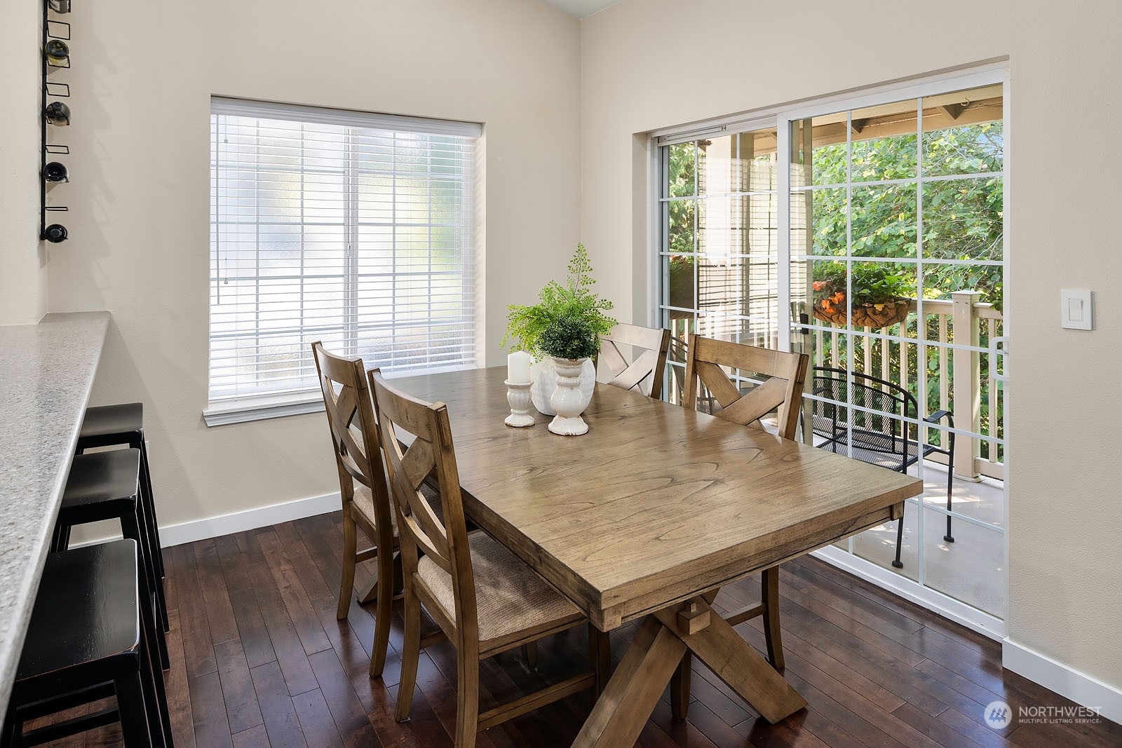 18651 Northeast 55th Way, Unit PP Redmond, WA 98052 - Photo 12 of 35 a view of a dining room with furniture window and wooden floor