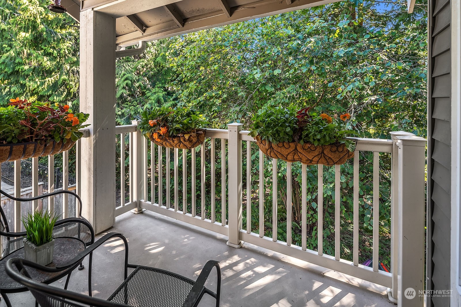 18651 Northeast 55th Way, Unit PP Redmond, WA 98052 - Photo 13 of 35 a view of a balcony with chairs