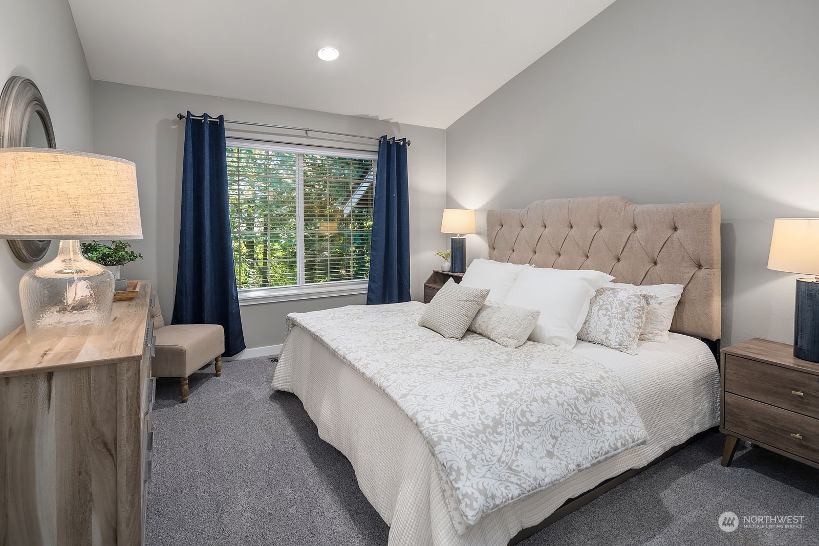 18651 Northeast 55th Way, Unit PP Redmond, WA 98052 - Photo 14 of 35 a large bed sitting in a bedroom next to a window