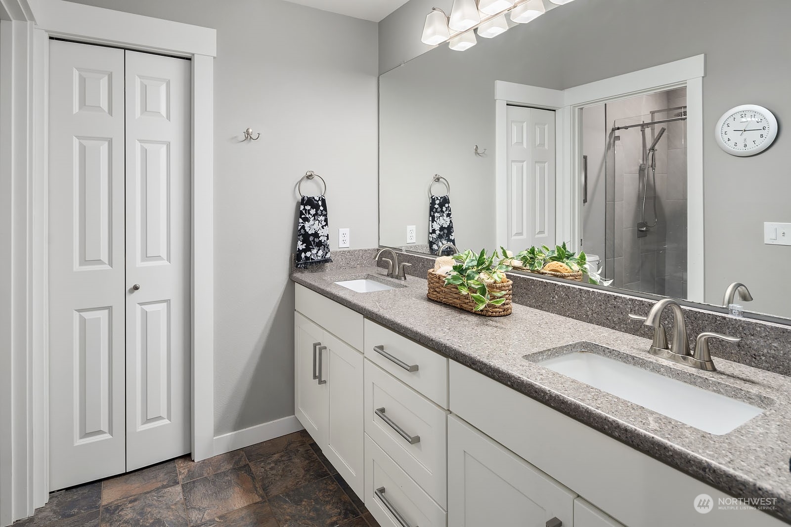 18651 Northeast 55th Way, Unit PP Redmond, WA 98052 - Photo 15 of 35 a bathroom with a double vanity sink and a mirror
