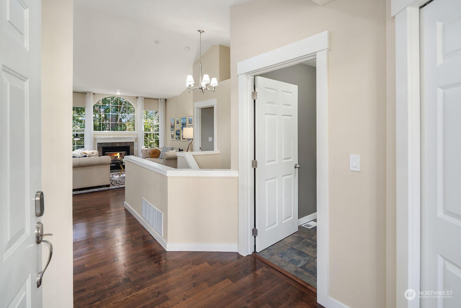 18651 Northeast 55th Way, Unit PP Redmond, WA 98052 - Photo 3 of 35 a view of kitchen with livingroom and hardwood floor