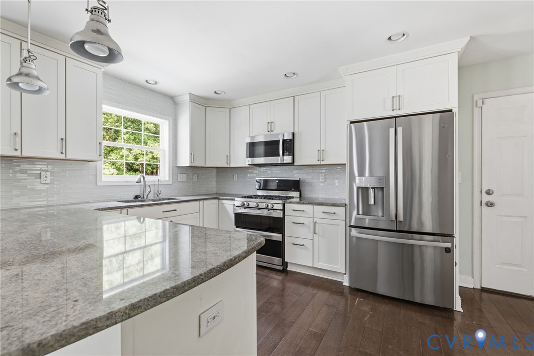 13524 Mountcastle Road Chesterfield, VA 23832 - Photo 12 of 44 Modern kitchen featuring white cabinetry, stainles