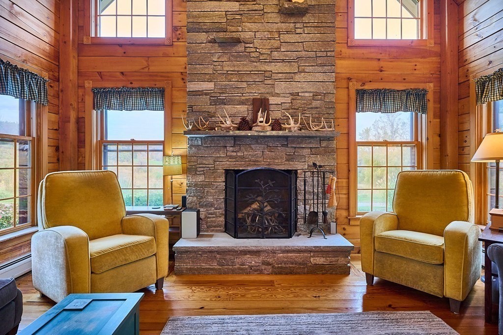 171 Tatro Road Ashfield, MA 01330 - Photo 11 of 42 a living room with furniture and a fireplace