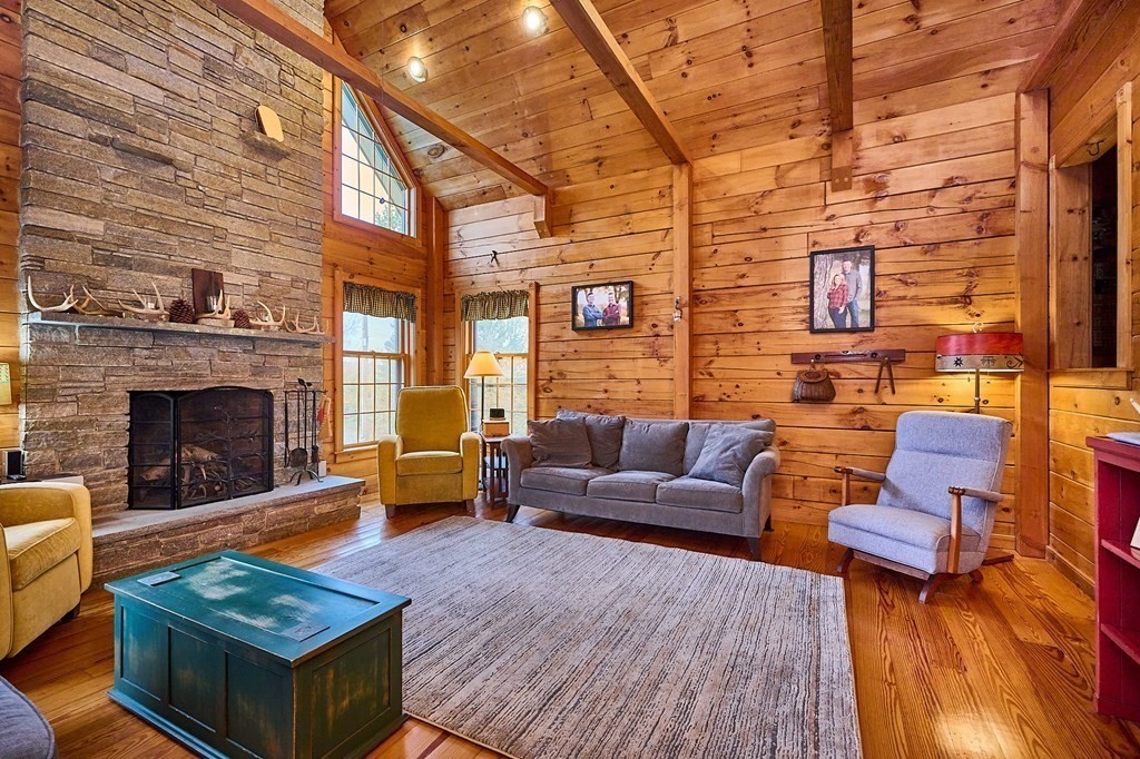 171 Tatro Road Ashfield, MA 01330 - Photo 12 of 42 a living room with furniture and a fireplace