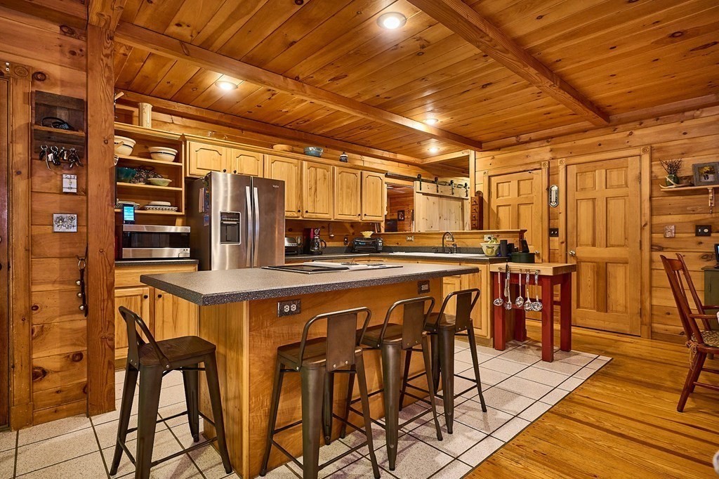 171 Tatro Road Ashfield, MA 01330 - Photo 14 of 42 a view of a dining room with furniture and wooden floor