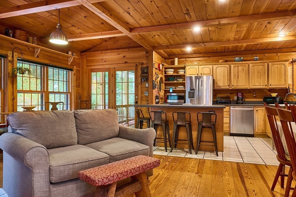 171 Tatro Road Ashfield, MA 01330 - Photo 15 of 42 a living room with furniture and a flat screen tv