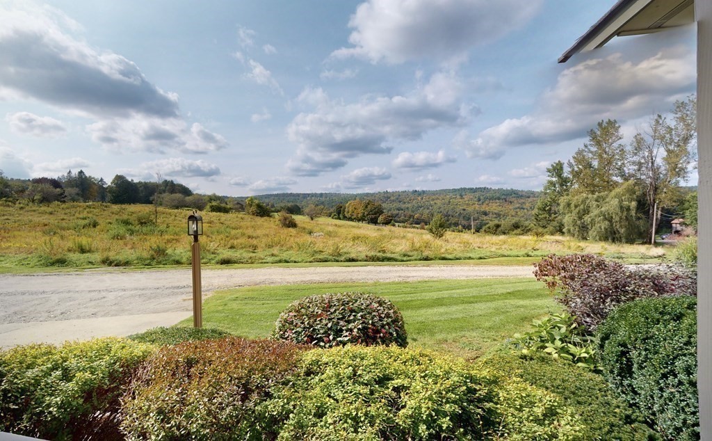 171 Tatro Road Ashfield, MA 01330 - Photo 2 of 42 a view of a big yard with an outdoor seating