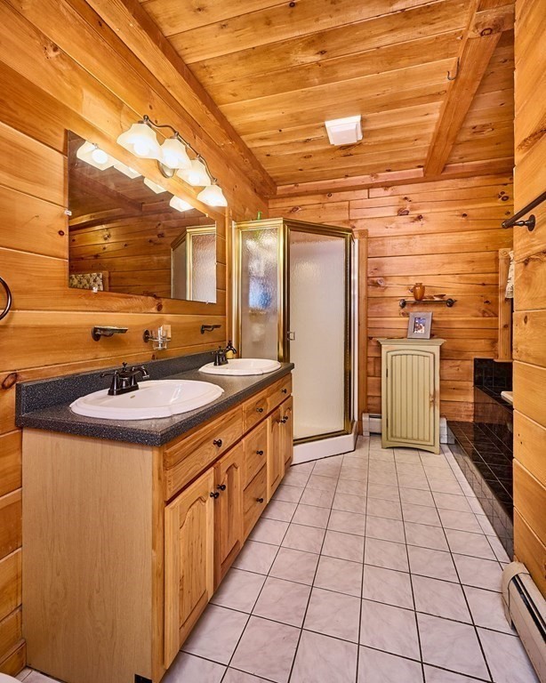 171 Tatro Road Ashfield, MA 01330 - Photo 23 of 42 a bathroom with a sink a mirror and a shower